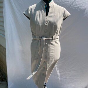 Classic, tailored, belted coatdress. Neutral beige.